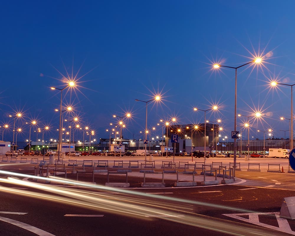 commercial property parking lot with parking lights turned on houston tx